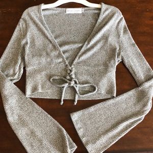 Cropped sweater with front lace-up detail 😍